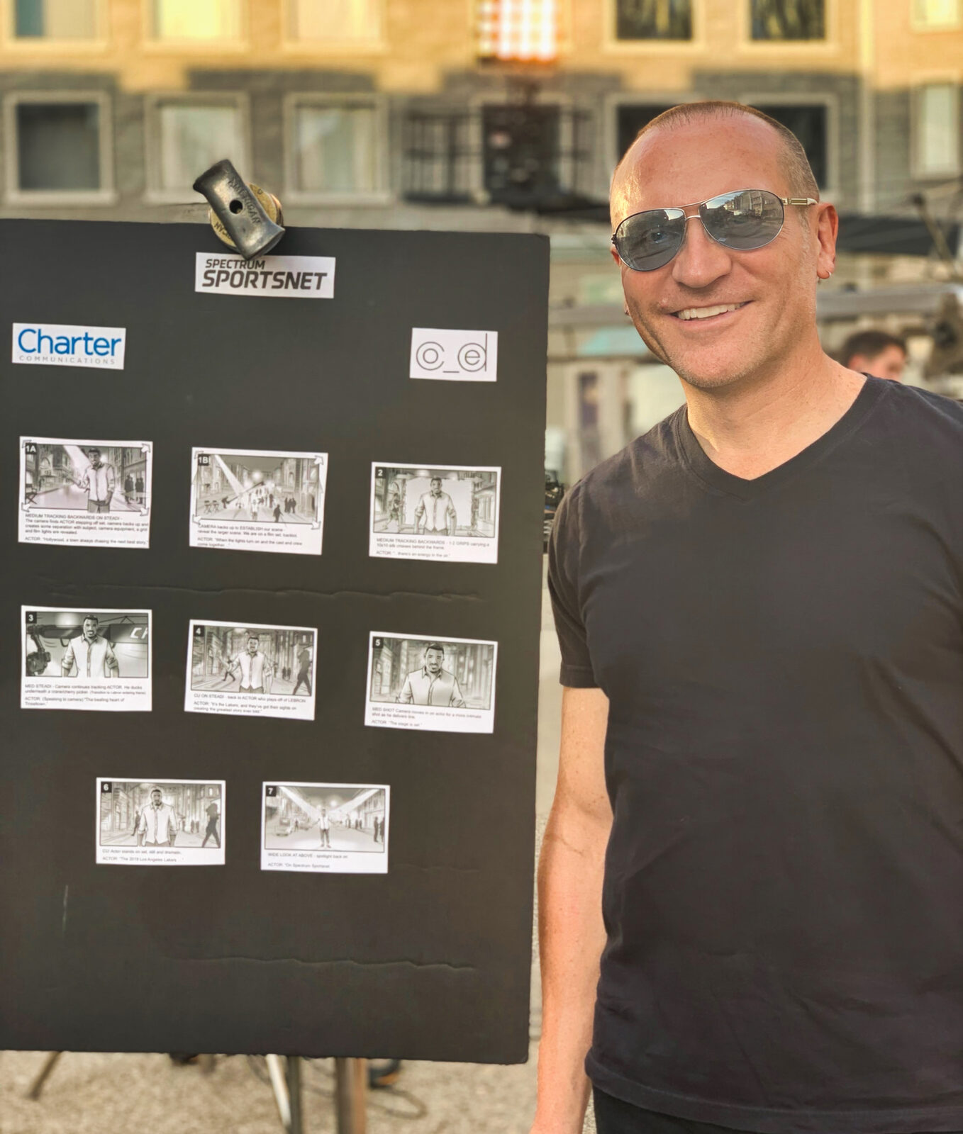 Lance LaSpina beside a display board of his storyboards